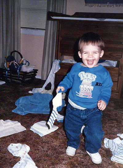 Ryan as a boy unpacking his dresser