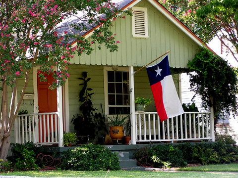 East Dallas home with Texas flag flying from the front porch (Credit: Marinell Turnage via Flickr)