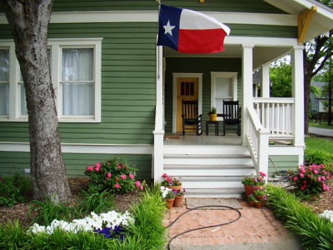 McKinney home with Texas flag flying from the front porch (Credit: Silky Hart)