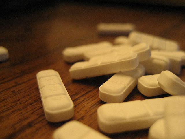 A small pile of 2mg (milligram) Xanax pills sitting on top of a table (Credit: Dean812 via Flickr)