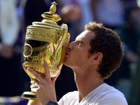 Andy Murray of Britain kisses the winners trophy after defeating Novak Djokovic of Serbia in their men's singles final tennis match at the Wimbledon Tennis Championships, in London July 7, 2013 (Credit: Reuters/Toby Melville)