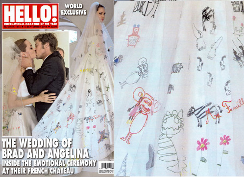 Angelina Jolie, on the day of her marriage to Brad Pitt at Chatea Miraval in the south of the France, poses for a photo in a satin gown, which was customized with drawings from the couple's six children sewn into the garment by Luigi Massi, the master tailor at Atelier Versace, August 23, 2014 (Credit: Hello! Magazine)