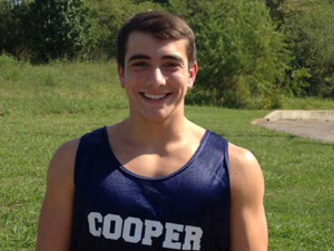 Seth Goldstein, a senior cross country runner at Cooper Yeshiva high school who saved another teen in a race, poses for a photo in his cross country kit (Credit: Goldstein family)