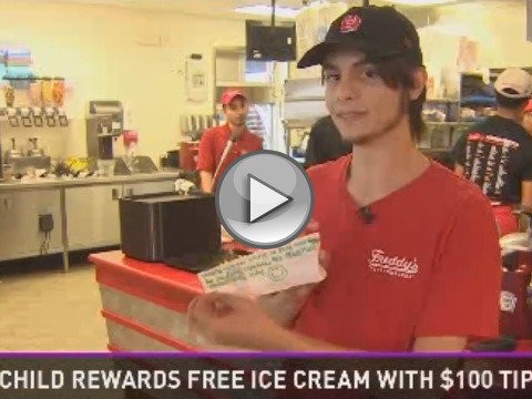 Travis Sattler holds the note, which was accompanied by $100 bill, from a little boy thanking him for helping to pay for the little boy's frozen custard at Freddy Frozen Custard and Steakburgers, in Katy, Texas, just west outside of Houston, March 20, 2015(Credit: KHOU)