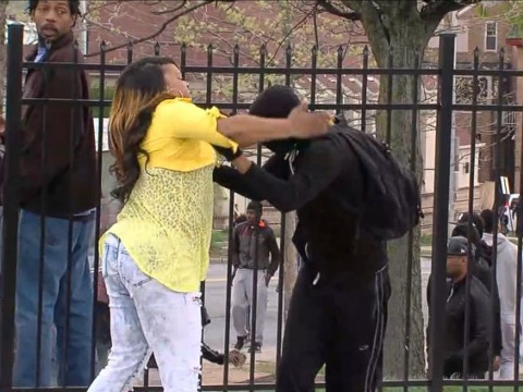 Toya Graham, a single mother of six, with one son, scolds her 16 year-old son, Michael, after pulling him out from the protests where he had joined protesters hurling rocks at police, Baltimore, Maryland, April 28, 2015 (Credit: ABC via Youtube)