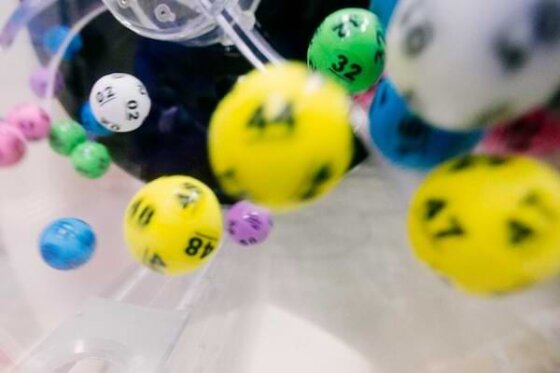 Colored lottery balls falling from the lottery bucket