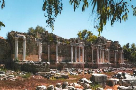 Ancient temple ruins with a blue sky backdrop.