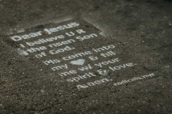 A grey marble stone with the salvation prayer etched in it. From the group radical.net, an organization that makes Jesus known among the nations.